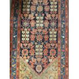 Antique Eastern runner with geometric medallions, on red and blue ground, 400cm x 100cm