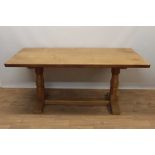 Robert Mouseman Thompson carved oak refectory table, rounded rectangular adzed top on facetted ends
