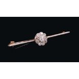 Edwardian diamond cluster bar brooch with a flower head cluster of old cut diamonds in platinum mill