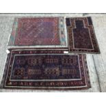 Bokhara style prayer rug, together with two further Bokhara style rugs