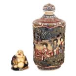 Finely carved and polychrome stained Chinese ivory snuff bottle and cover, together with a small car