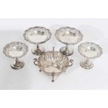 Set of four Victorian silver pierced bon-bon dishes, together with another similar