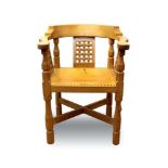 Robert Mouseman Thompson carved oak tub chair, with lattice back and stud closed leather seat on cha