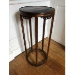 19th century Chinese hardwood stand, the circular top supported on five reeded legs joined by shaped