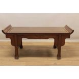 Antique Chinese hardwood low table, with scrolled ends on moulded carved legs ans knotwork carved fe