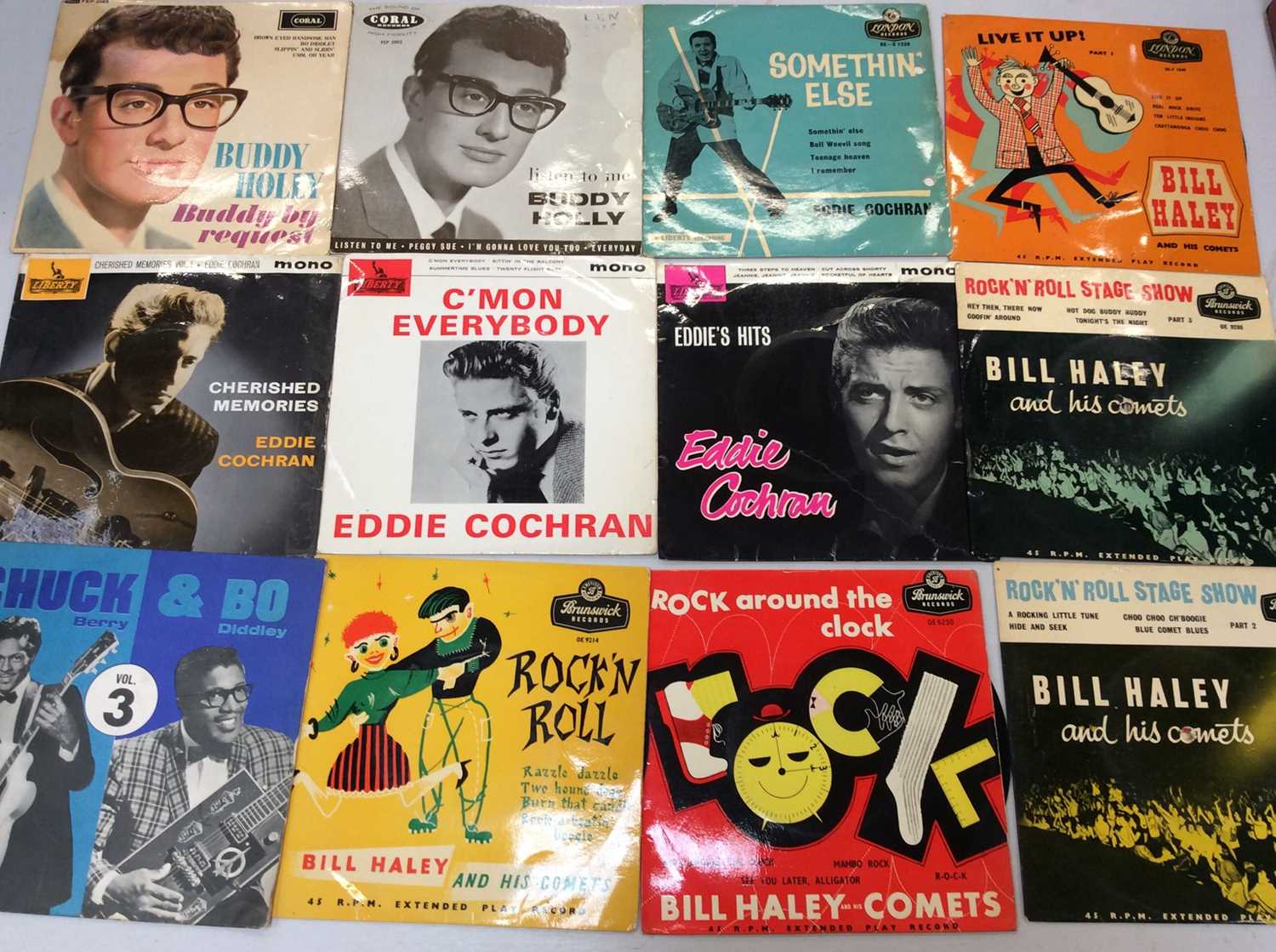 Carrying case of 40 EP's including Bill Haley, Buddy Holly, Eddie Cochran, Chuck Berry, Elvis and Fa