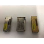 Two vintage Dunhill pocket lighters together with another (3)