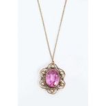 Early 20th century 18ct gold pink stone and seed pearl pendant with an oval mixed cut pink stone, po