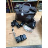 Olympus OM-1, lenses and other accessories in leather bag