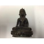 Tibetan bronze Buddha, shown seated cross-legged on a lotus base, 20.5cm high, together with a furth