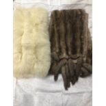 Two wide Mink fur stoles, one with tippet tail trim plus an Artic Fox fur stole.