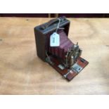 Vintage 'Ideal Wizard' folding camera with red bellows