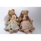 Two mohair teddies with amber eyes and rexine pads plus two Pedigree dolls