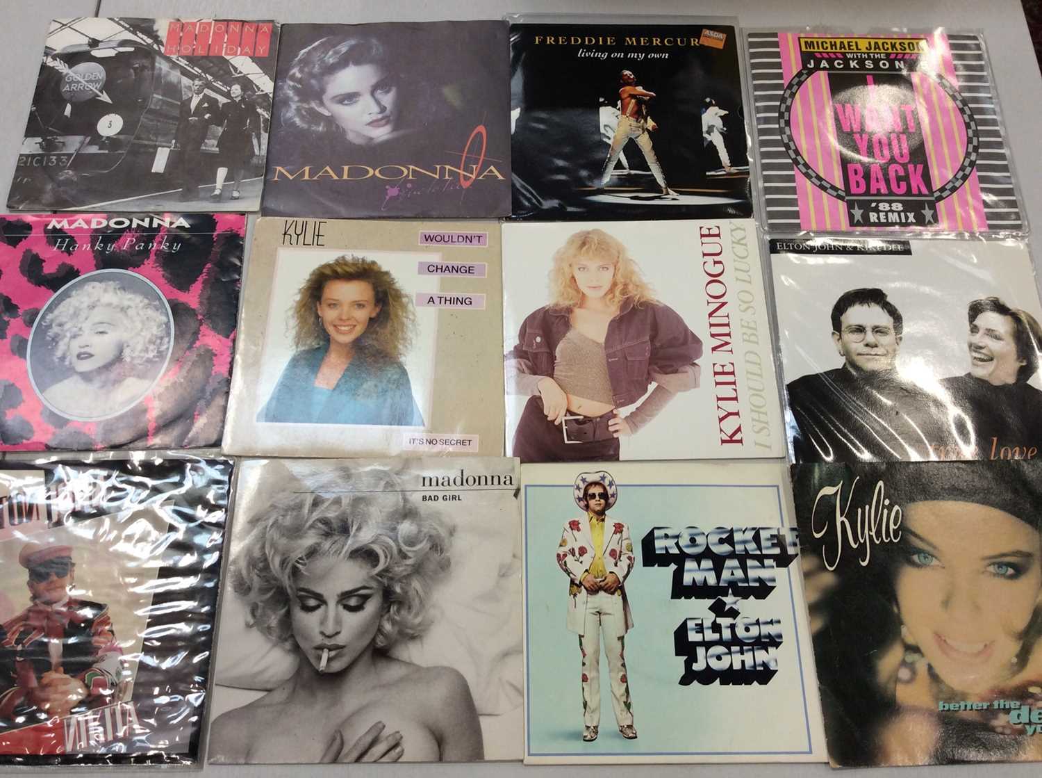 Two boxes of single records including Elton John, Blondie, Kate Bush, Madonna, Joy Zipper, Gary Numa