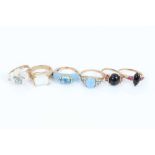 Six 9ct gold gem set dress rings