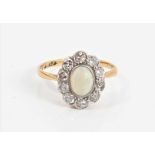 Edwardian 18ct gold opal and diamond cluster ring in millegrain setting, size K½