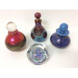 Okra iridescent glass paperweight/bottle with stopper and two other similar