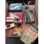 Selection of childrens toys, games and books including Enid Blyton, cloth books, blow football, tin