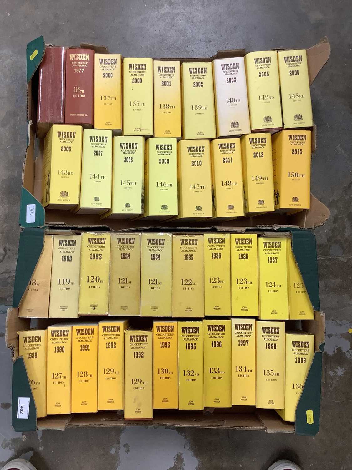 Two boxes of Wisden books