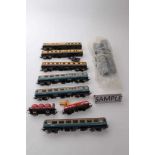 Railway 00 gauge selection of unboxed models including Diesel locomotive, carriages, rolling stock a