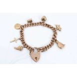 9ct gold curb link bracelet with seven gold charms