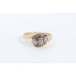 18ct gold diamond three stone ring in diamond set crossover setting