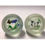 Two Caithness glass paperweights with butterfly ornament