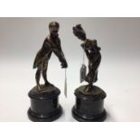 Pair of figures on serpentine bases together with a circular casket