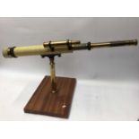 Lacquered brass library telescope on mahogany stand