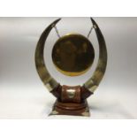 Edwardian oak and brass dinner gong with cow horn supports