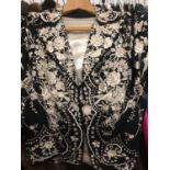 Chinese black silk jacket with cream embroidered flowers and birds, cream silk lining, circ.1960's