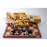 Four Pelham puppets and an antique wooden chess board