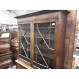 Regcncy and later mahogany and oak two height bookcase, the upper earlier section enclosed by a pair