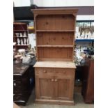 Pine two height dresser with shelves above, two drawers and two panelled doors below, 90cm wide, 38c