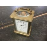 Late 19th / early 20th century brass carriage clock, indistinctly signed Hamilton & Co., with subsid