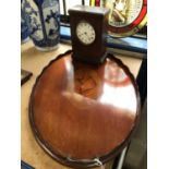 Edwardian mahogany galleried tray with inlaid shell pattern, together with a mahogany mantel clock