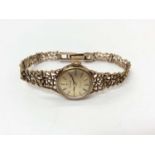 9ct gold ladies Tissot Stylist wristwatch on 9ct gold open work hinged bracelet