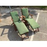 Pair of modern teak steamer chairs of typical form, with green fabric cushions
