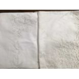 Two fine cotton white embroidered table cloths, plus two ivory linen embroidered table cloths with s