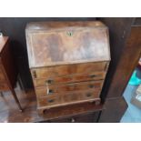 George I style figured walnut veneered bureau of small proportions, with fitted interior, inlaid her