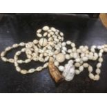 Collection of ivory necklets and small statue