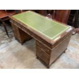 Good quality early 20th century mahogany twin pedestal desk with inset leather lined top and nine dr