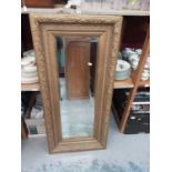 Wall mirror in ornate gilt frame, 53.5cm wide, 115cm high