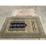 Eastern rug on blue and Beije ground and one other 182x120cm, 135x85cm