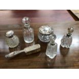 Selection of silver topped perfume bottles, cream jar and monogrammed hair brush (6)