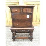 18th century-style oak miniature chest on stand with an arrangement of two short and two long drawer