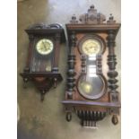 Two late 19th / early 20th century walnut cased wall clocks