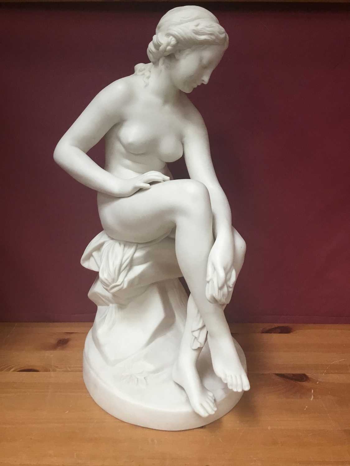 19th century Parian porcelain sculpture of seated female nude, approximately 38cm.