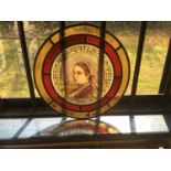 Victorian stained glass circular panel, painted depicting a portrait of Queen Victoria, dated 1887,