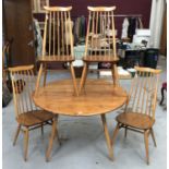 Ercol Golden Dawn drop leaf table and set of four Ercol stick back chairs